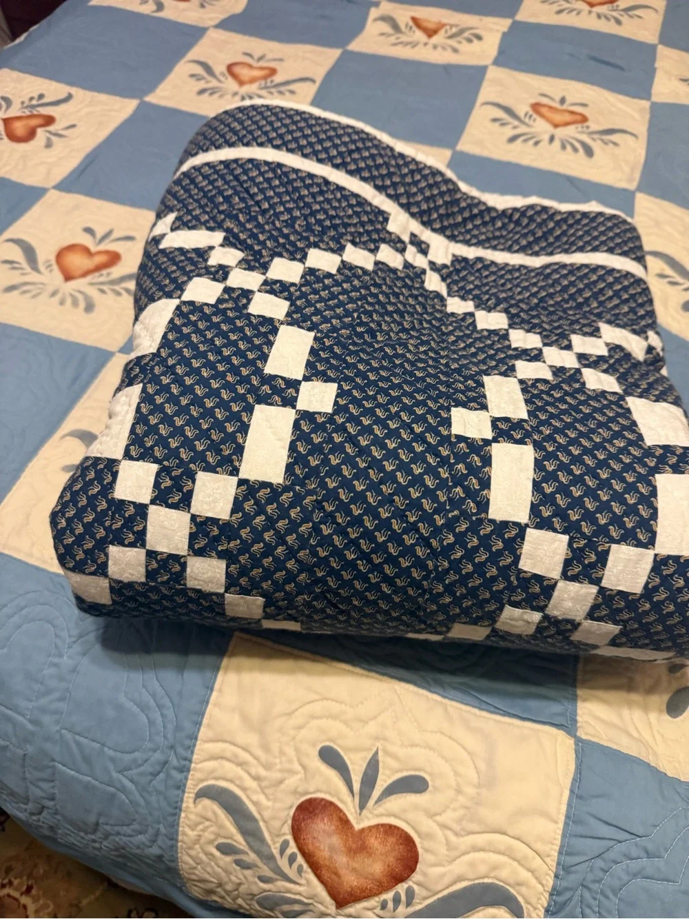 handmade patchwork quilt features the traditional Burgoyne Surrounded pattern